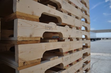 Stack of white wood pallets